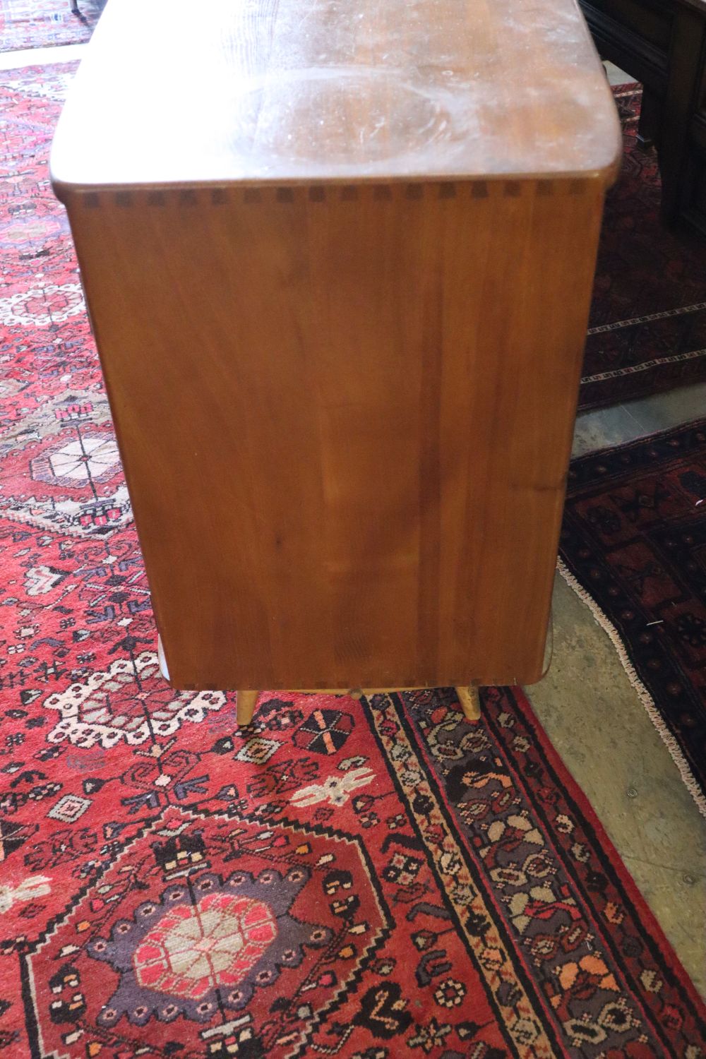 An Ercol sideboard, width 114cm, depth 50cm, height 81cm